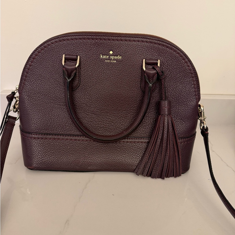 Kate Spade Pebbled Leather McCall Street Carli Plum Doom Satchel with Tassel